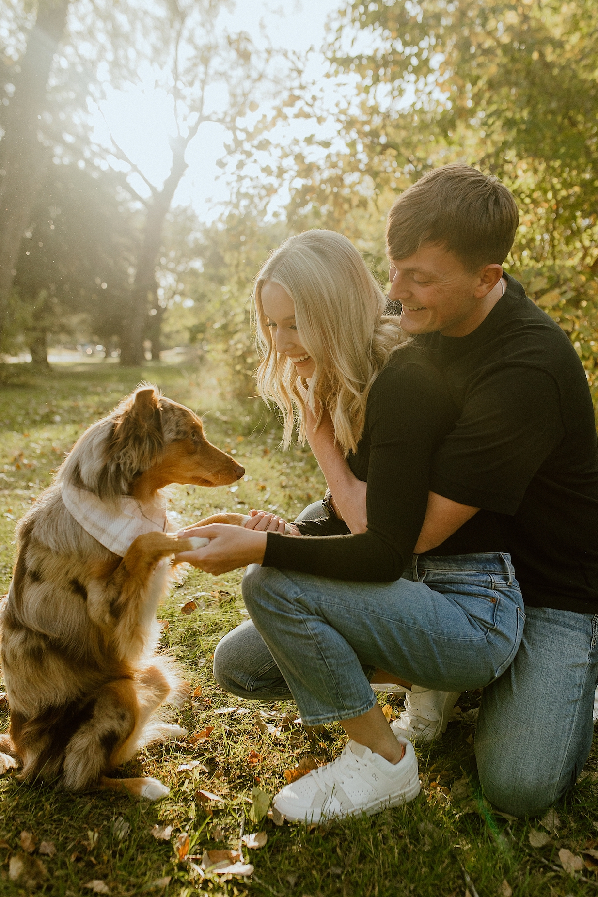 engagement couple with their dog sunshine and outdoors help not awkward in photos