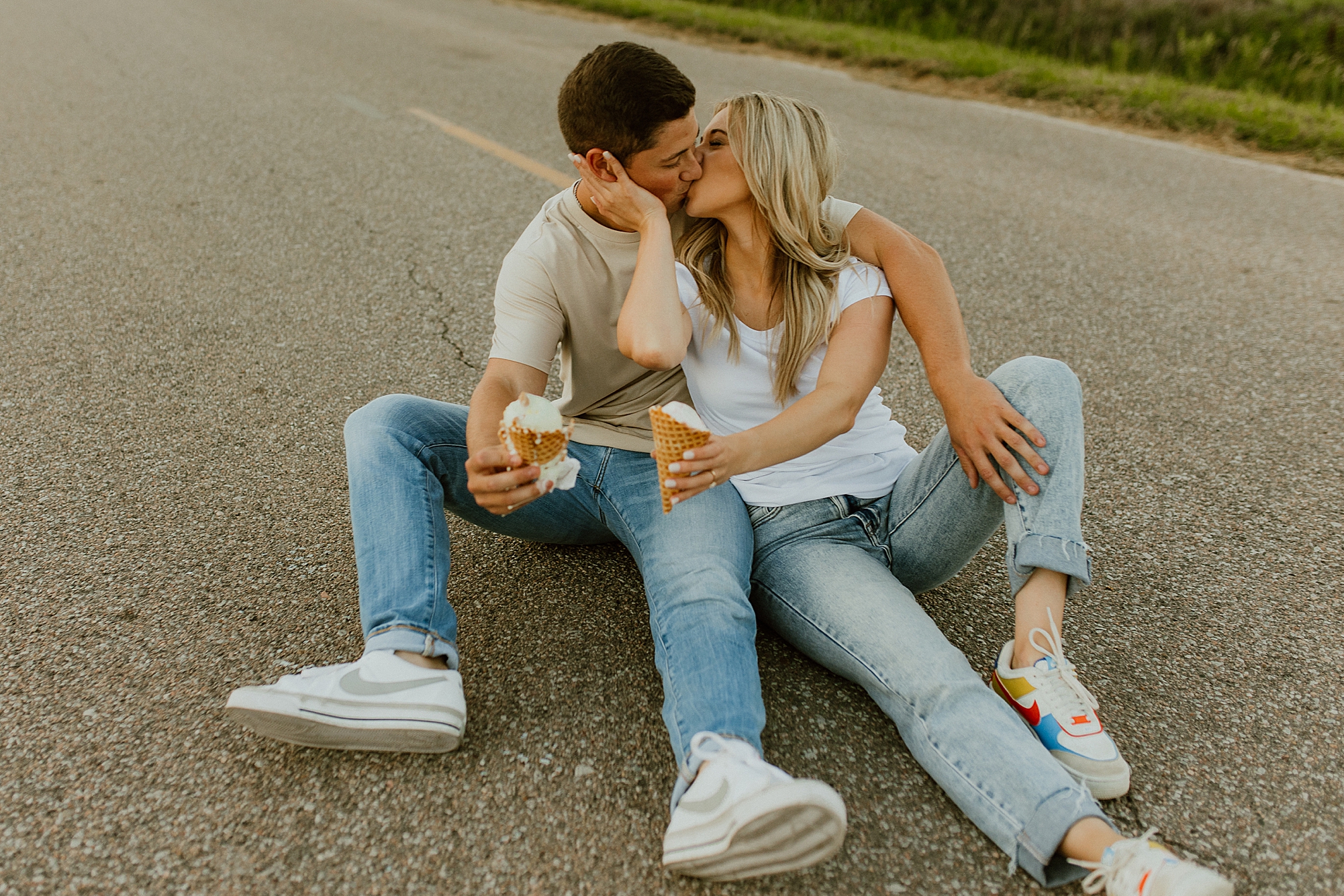 in the middle of a street is the best location for this engagement couple photo shoot eating ice cream casual fun