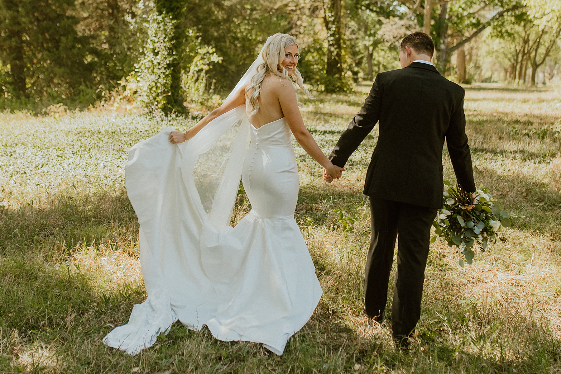 bride and groom wedding photo outdoors wedding dress and veil