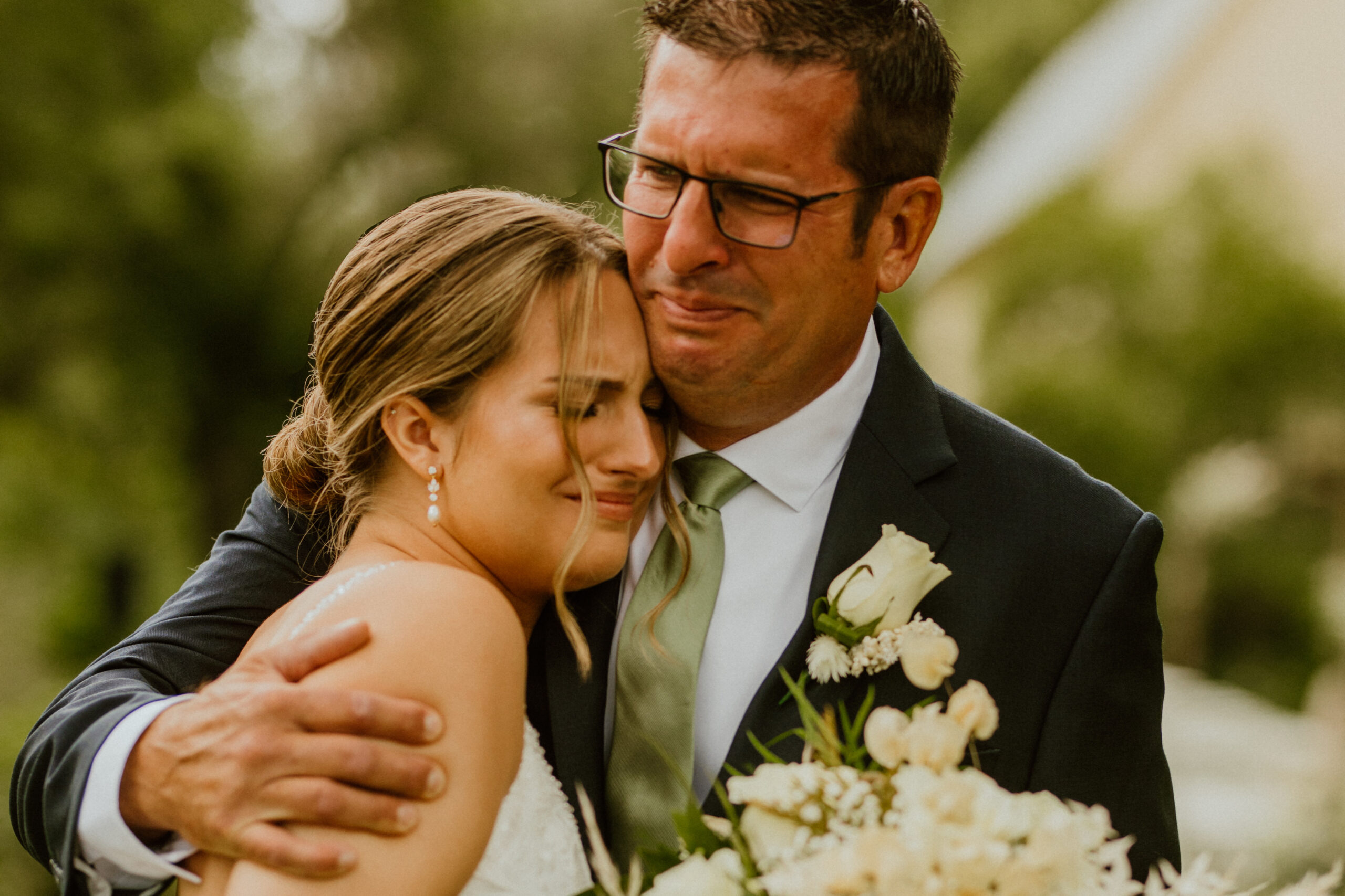 wedding photographer captures an emotional moment between the bride and her father