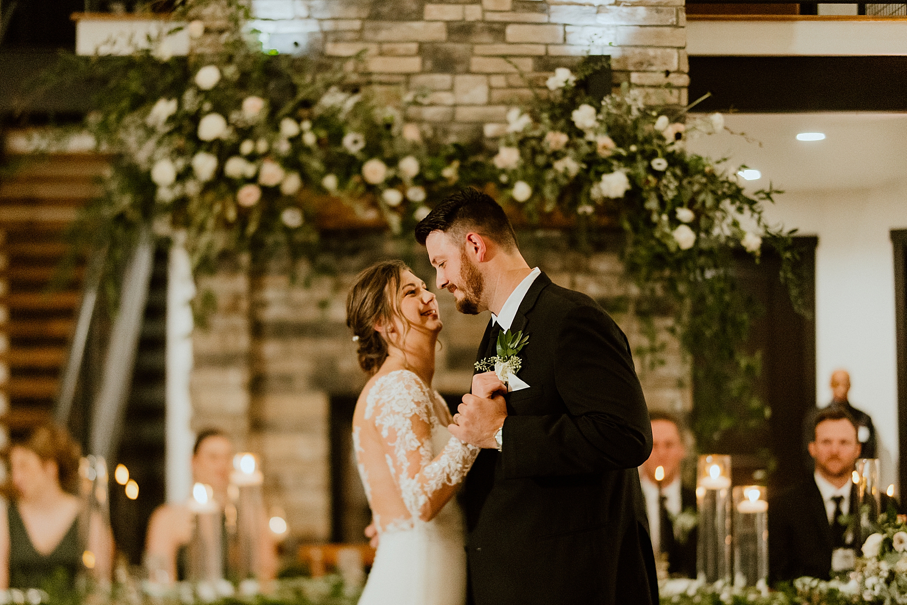 bride and groom personalize reception area and first dance at their wedding reception