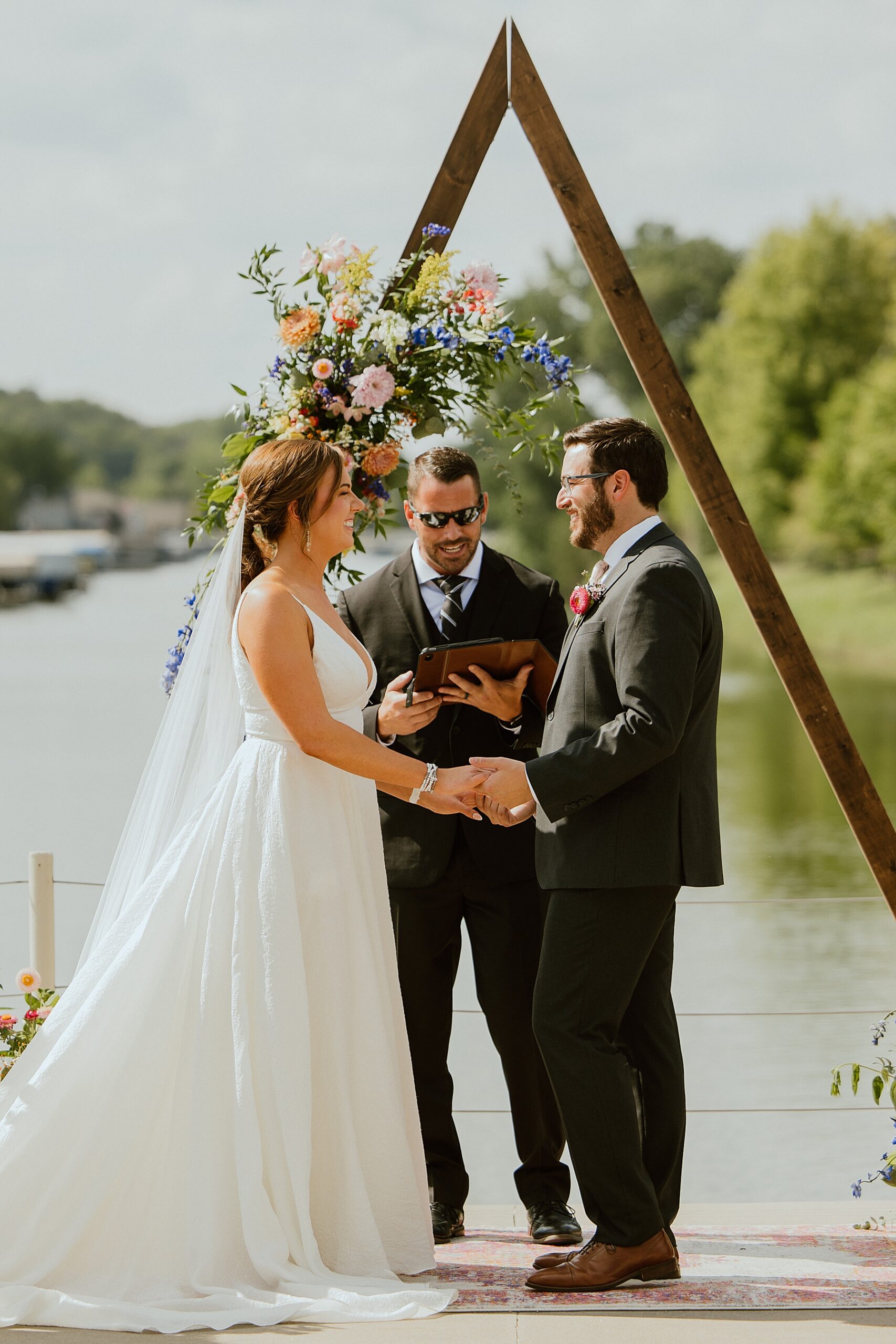 special officiant for your fairy tale wedding bride and groom next to lake getting married