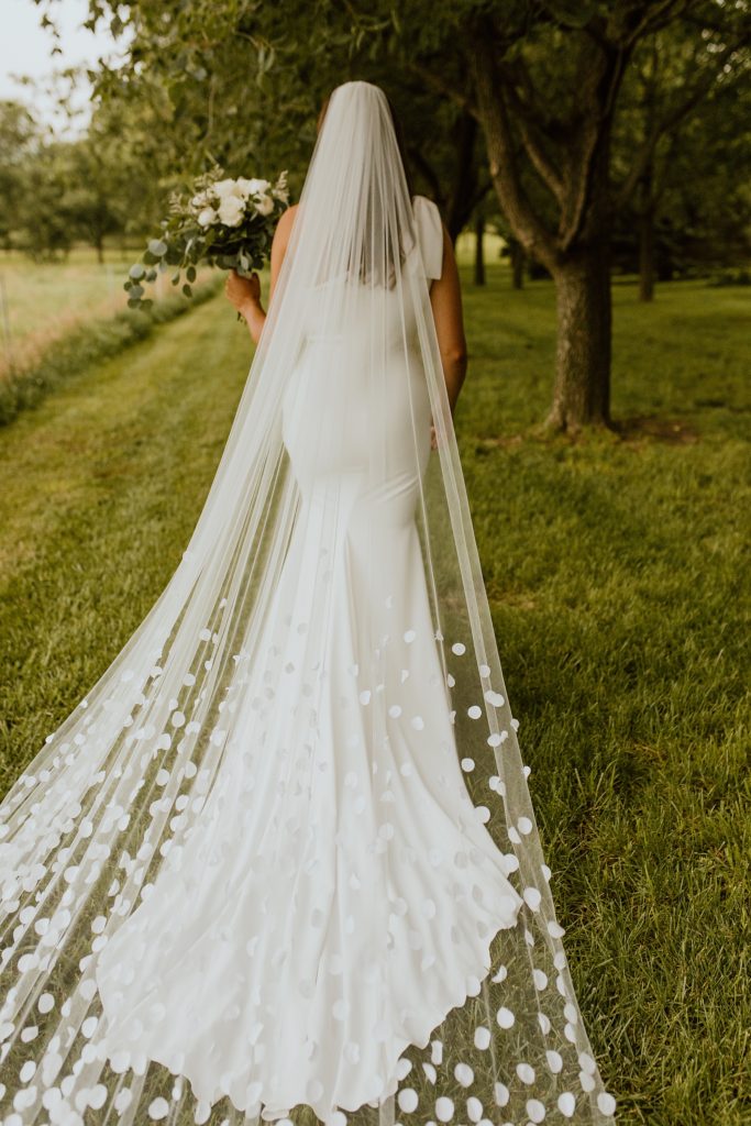bride with wedding headpiece of a textured veil