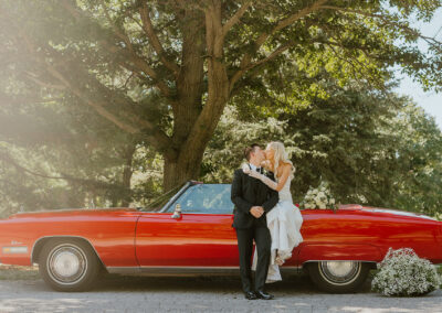 Elegant Wedding With Red Car At Train Station