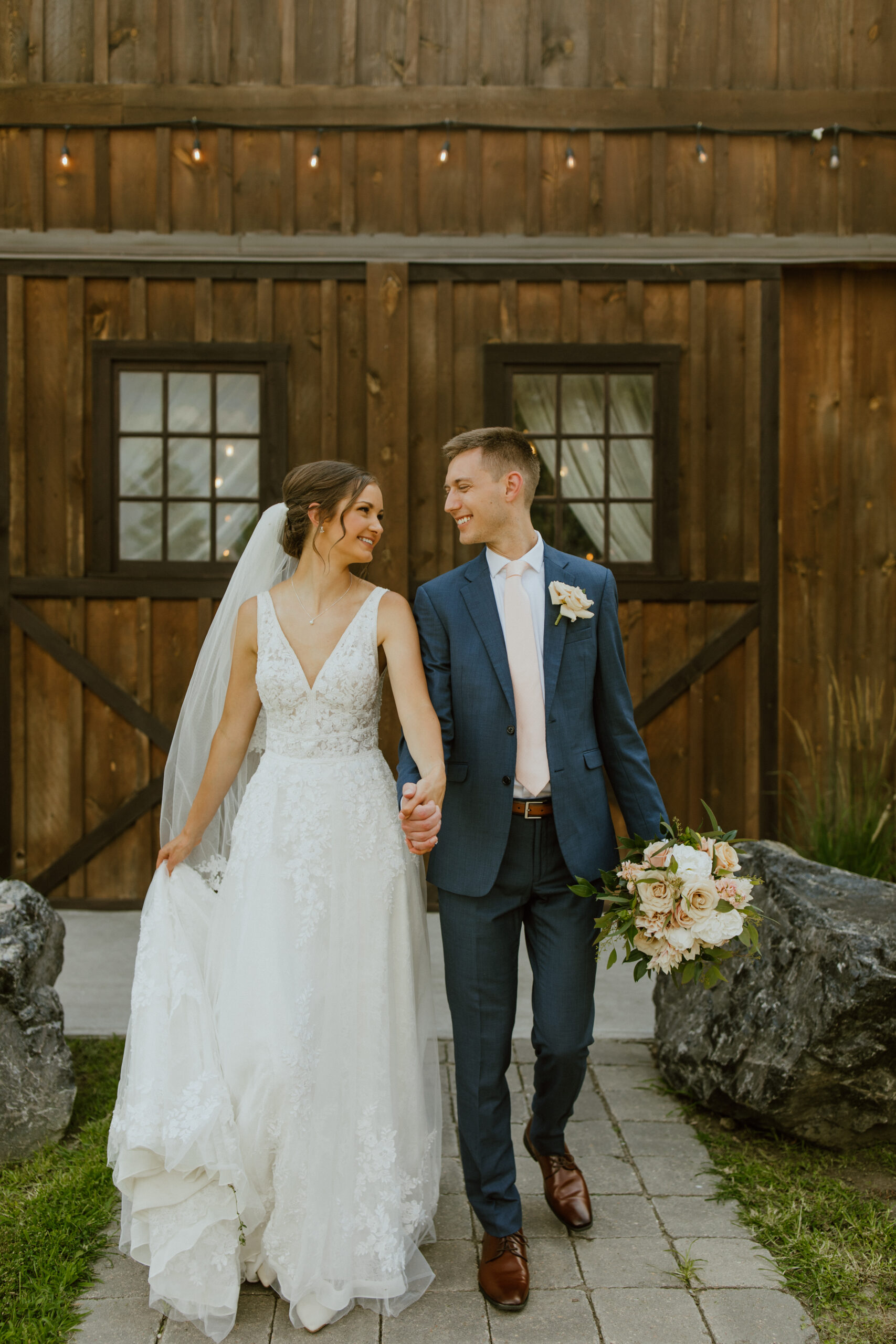 bride and groom recessing from wedding shot by quality associate wedding photographer